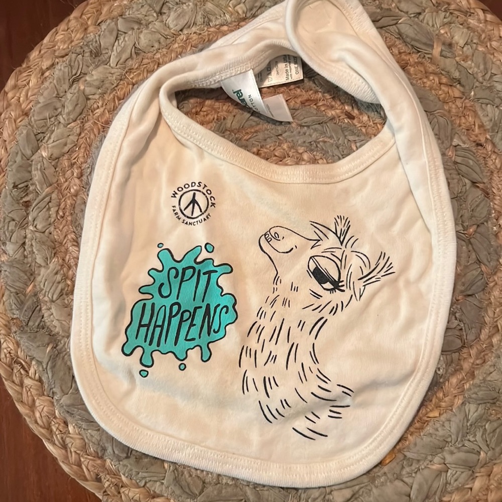 Woodstock Farm Sanctuary “Spit Happens” Bib with llama